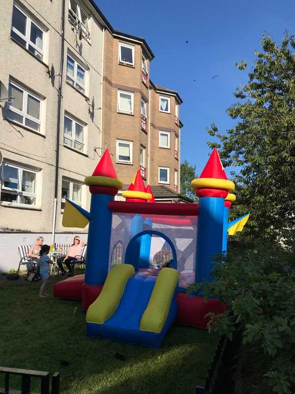 Bouncy castle in front garden of tenemant flat